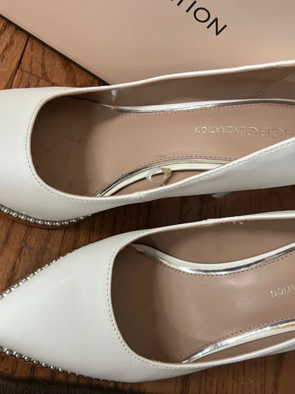 White heels with silver rhinestone accent
